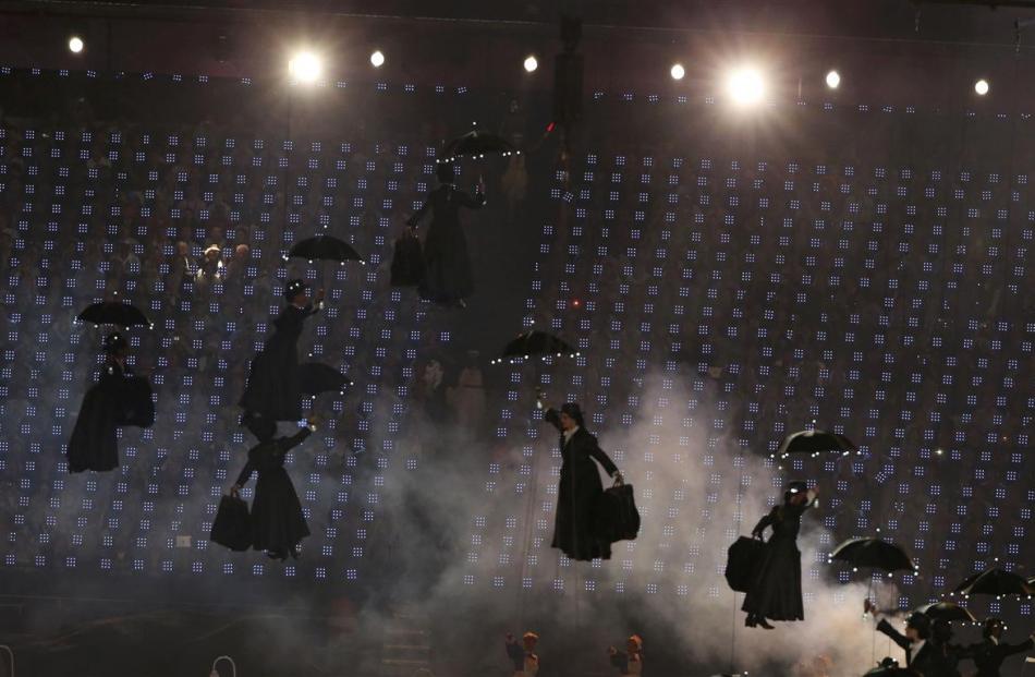 Performers dressed as Mary Poppins descend on the stadium.  REUTERS/David Gray