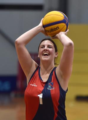 Morgan Kinzett, of South Otago High School, aims for the basket in a 3x3 basketball match.
