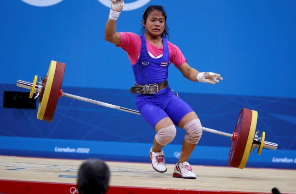 Thailand's Sirivimon Pramongkhol drops weights on the women 48kg Group A weightlifting competition.