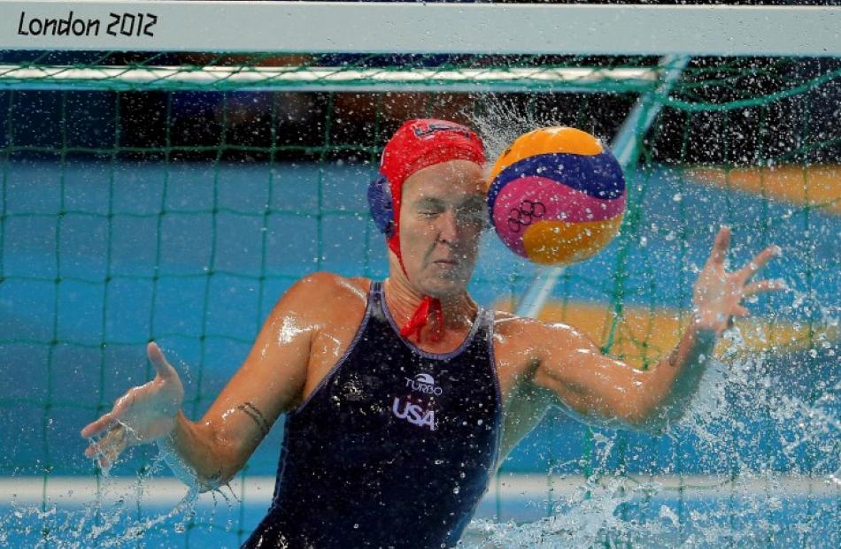 US goalkeeper Betsey Armstrong is hit by the ball during their women's preliminary round Group A...