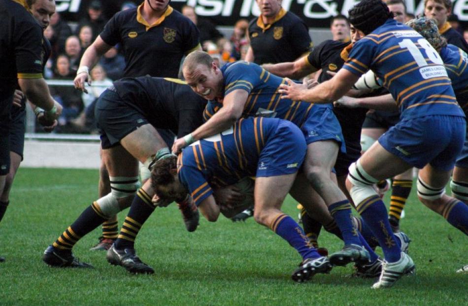Taieri battle to progress the ball upfield against the strong Dunedin defence.