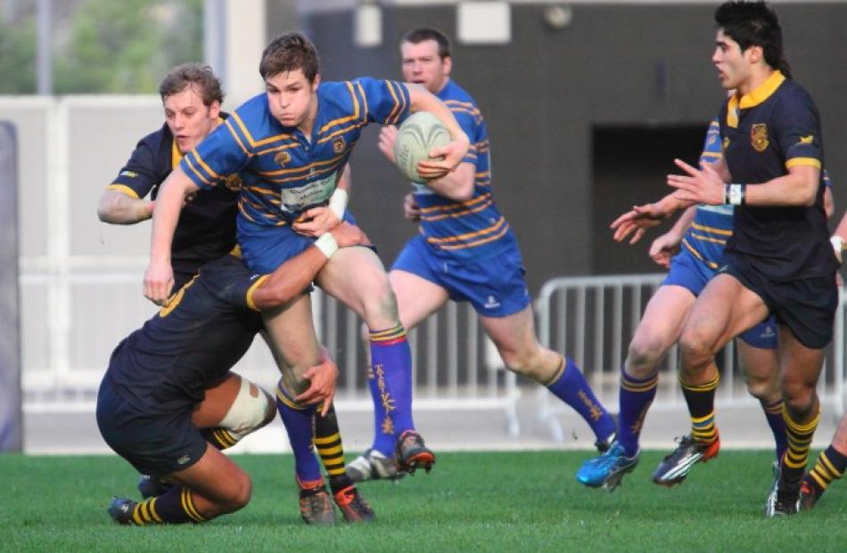 Taieri centre Michael Collins breaks the advantage line.
