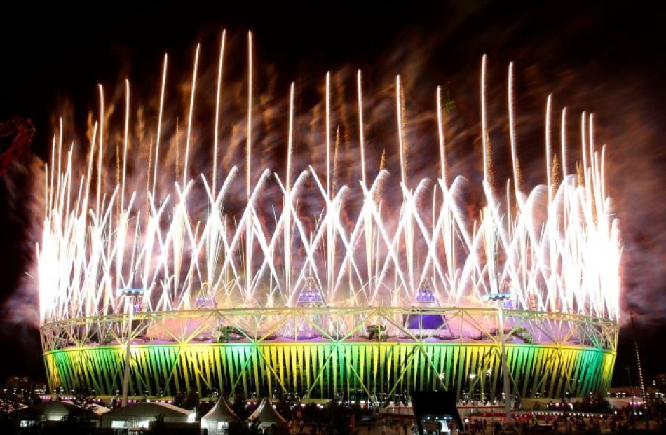 Fireworks explode over the Olympic Stadium. REUTERS/Tim Wimborne