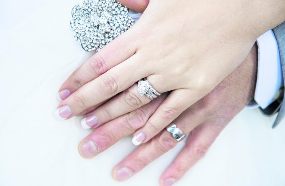 The rings of Carlie and Marcus Baker, who married in Queenstown. ASPIRING PHOTOGRAPHY.