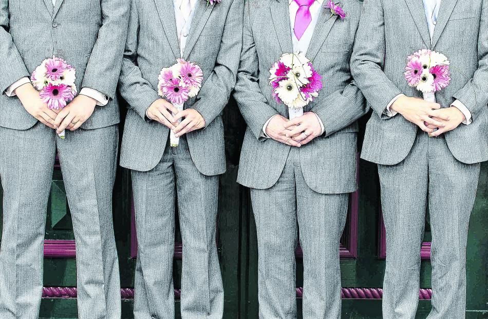 Flower power... Clancy Reid and his attendants. 
REBECCA MCSKIMMING PHOTOGRAPHY.