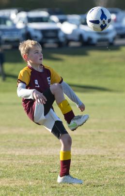 Maori Hill Red player Ollie Agnew (9) warms up before a game at the annual Green Island Junior...