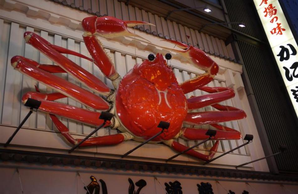 A giant mechanised crab marks the entrance to Dotonbori.