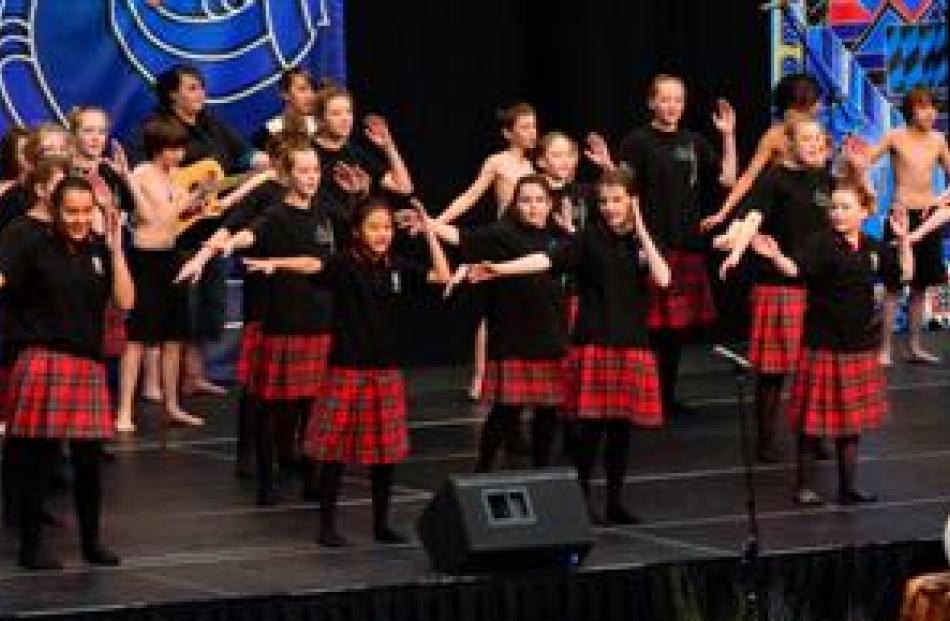 Dunedin North Intermediate School pupils light up the stage.