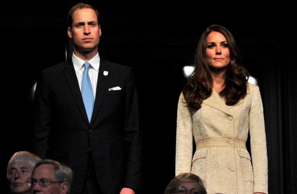 Prince William and his wife Catherine, Duchess of Cambridge stand during the ceremony. REUTERS...