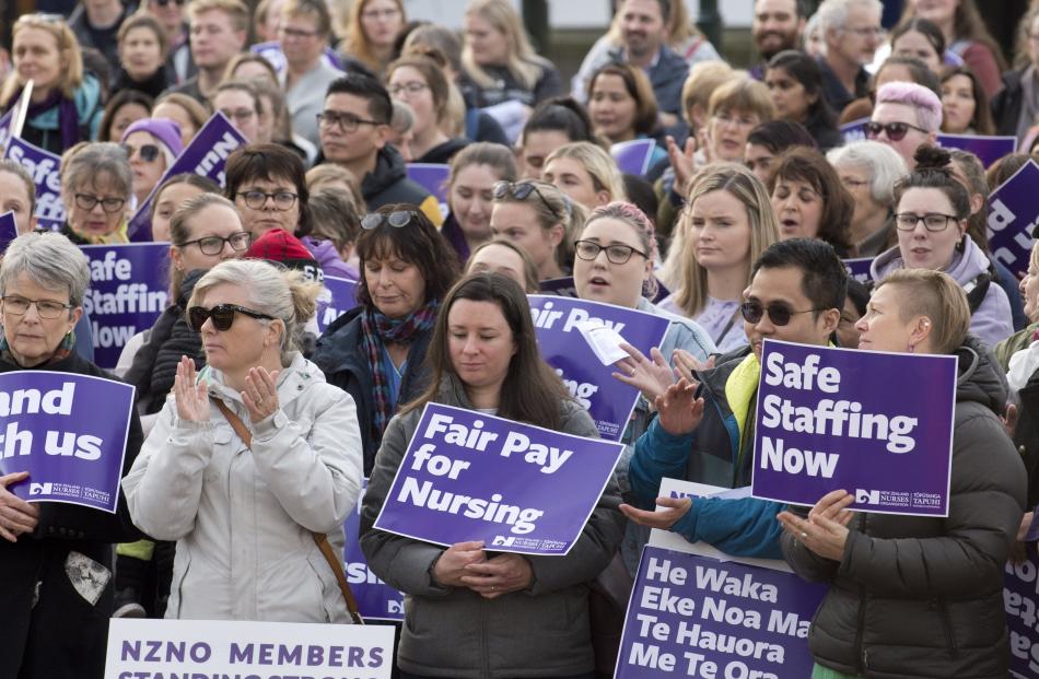 Striking nurses listen to speeches in The Octagon in Dunedin today. Photos: Gerard O'Brien