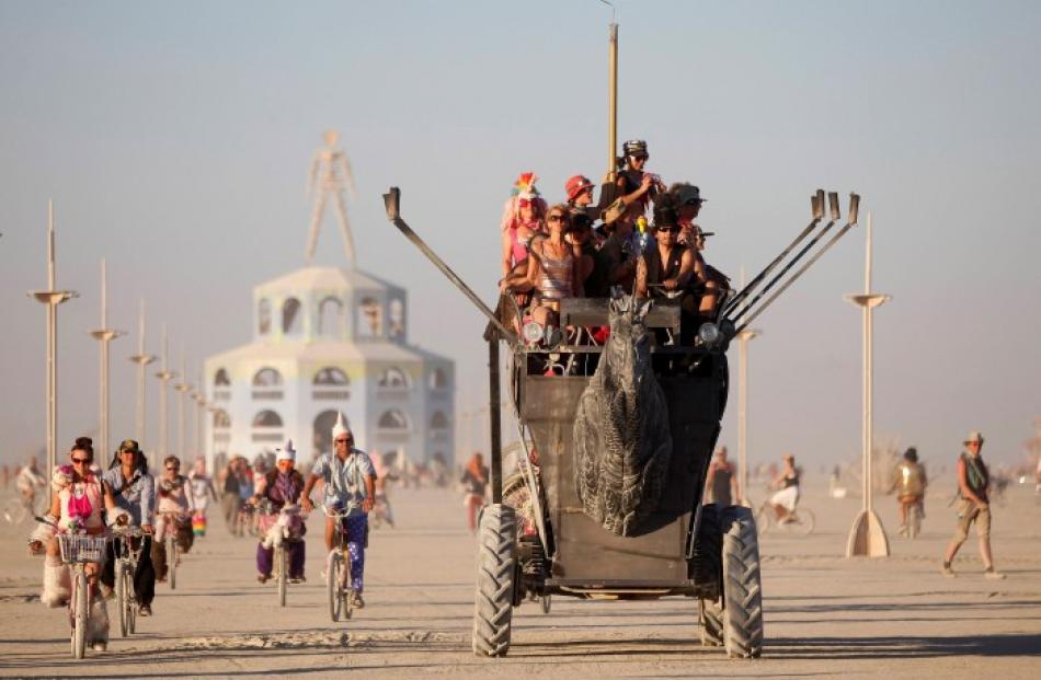 Participants ride an art car during the Burning Man 2012 'Fertility 2.0' arts and music festival...