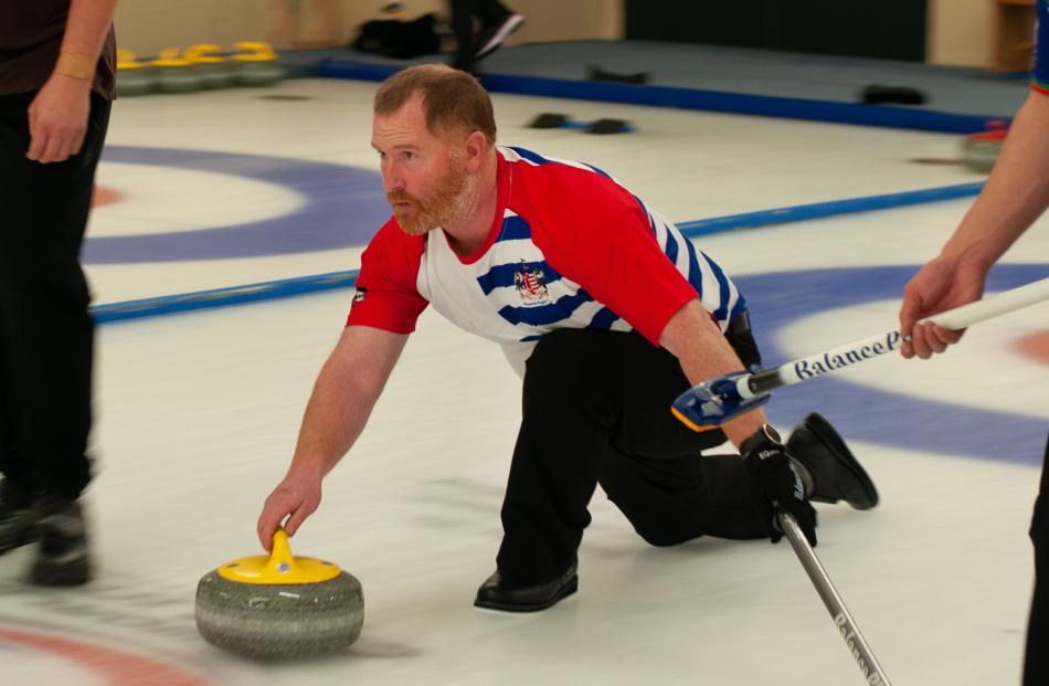 Former New Zealand Olympic curler Warren Dobson aims yesterday. 