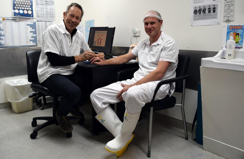 Oamaru Physiotherapy Clinic co-practice principal Mike Stewart (left) treats the injured finger...