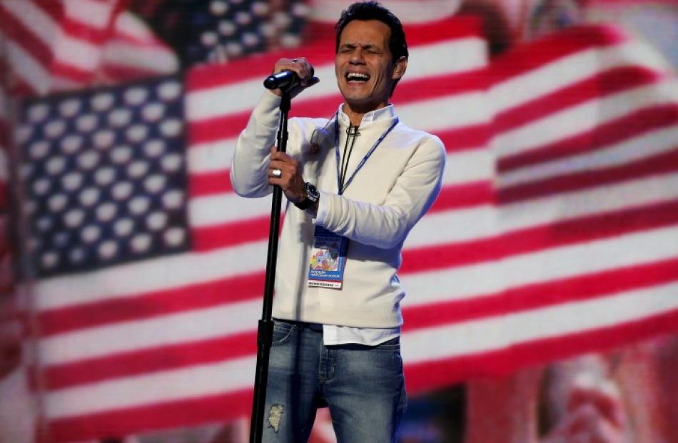 Singer Marc Anthony rehearses the national anthem before the final session of the Democratic...