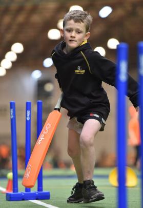 George Scott (8), from Waikouaiti School, sets out for the other end.