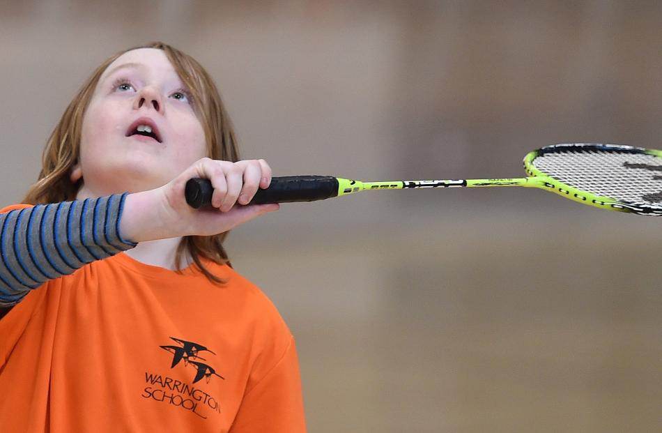 Khan Armstrong (9), from Warrington School, eyes the shuttlecock.