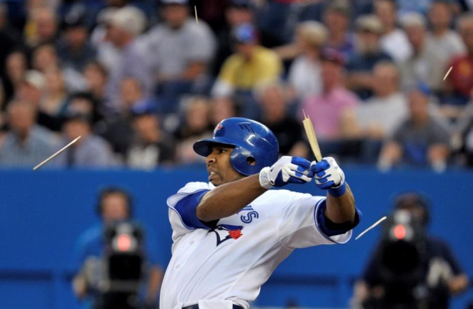 Toronto Blue Jays batter Edwin Encarnacion breaks his bat on a ground out against the Seattle...