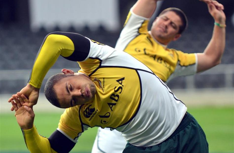 Habana (left) and Morne Steyn stretch before a training session.