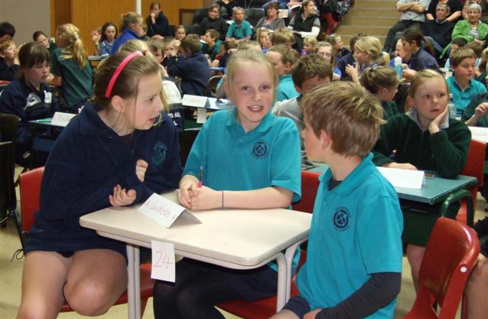 Goldfields School pupils (from left) Ellie Isaac (10), Olivia Bates (10) and Jack King (9) talk...