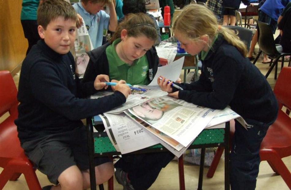 Poolburn School pupils (from left) Fynn Goodlass  (10), Shaye (11) and Anna (10) Scott pore...
