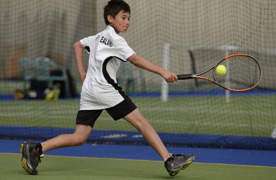 Auckland junior Raphael Savelli (10) in action during a first-round singles game.