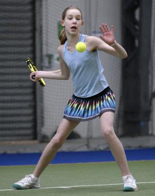 Chloe Rawlence (12), of Auckland, lines up a forehand.
