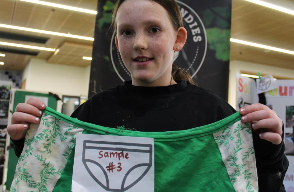 Charlotte Scott (10), of Waikouaiti, shows how undies can reveal soil health.