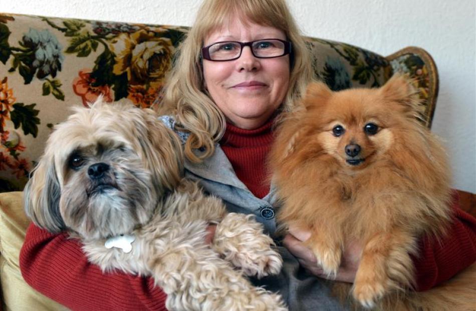 Patricia  Reid last night with two of her dogs, Ewok (left) and Mushka, whom she threw out of the...