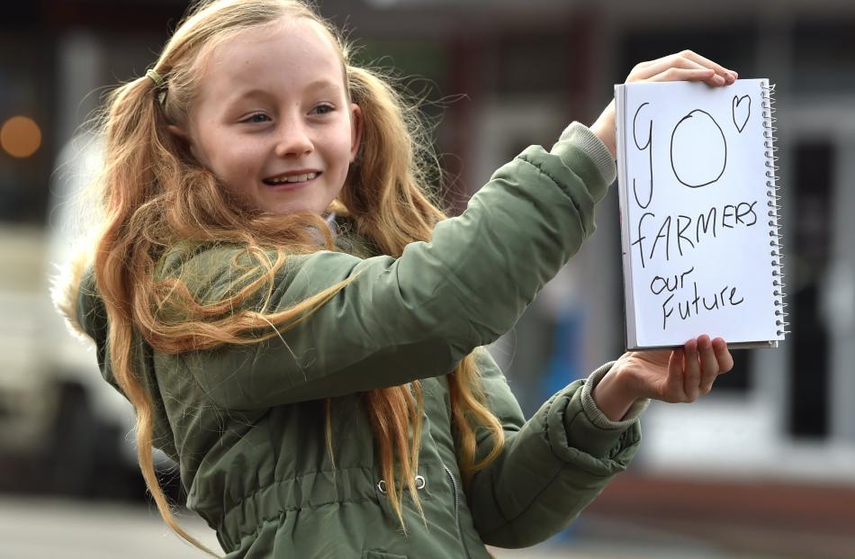 Maggie Smither-Clark (9), of Dunedin, shows her support for the Dunedin protest.PHOTO: CHRISTINE...