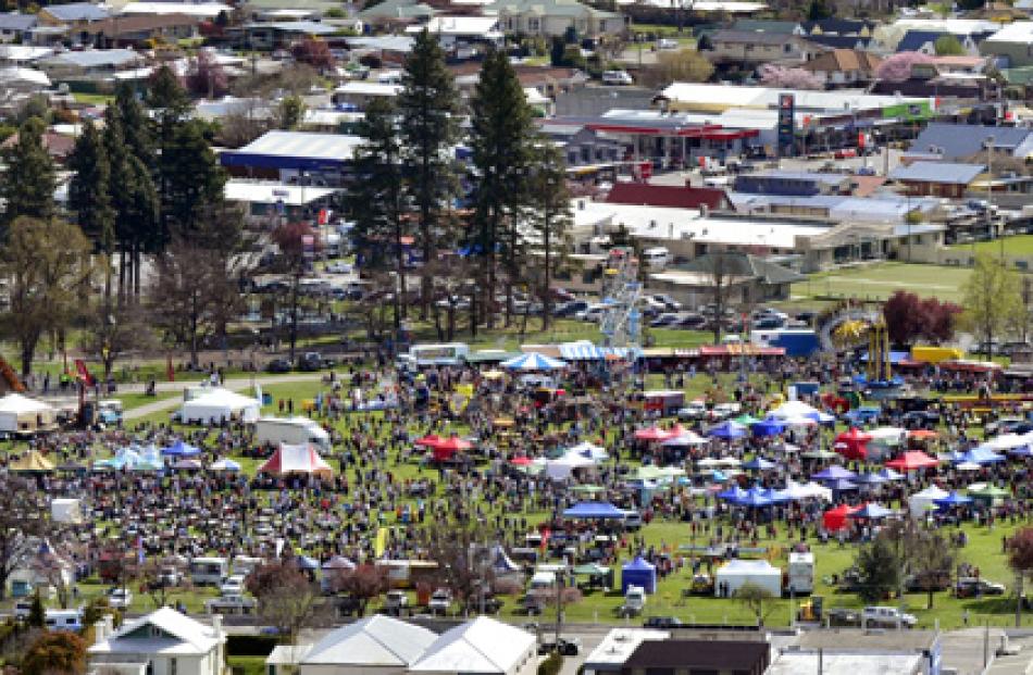 Crowds pack into Pioneer Park after the Blossom Festival Parade.