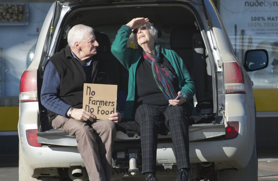 Sheep and beef farmers Trevor and Ruth Stewart, of Mokoreta, hold a “no farmers , no food” sign...