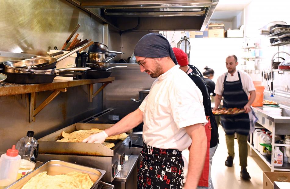Chef Nicolo Mollica, from the Esplanade, prepares roti for the main course.
