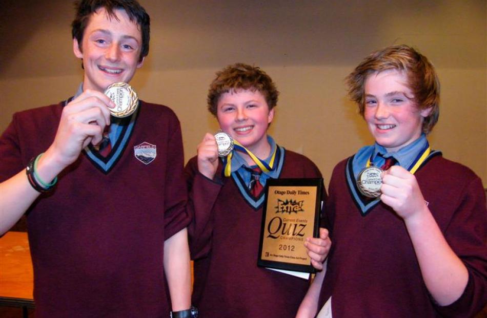 Displaying their winners' medals after claiming the trophy at the Otago Daily Times Extra!...