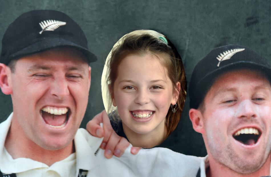 Posing in a cutout stand of the Black Caps team is Ora Winklemann (10), of Dunedin. PHOTO: PETER...