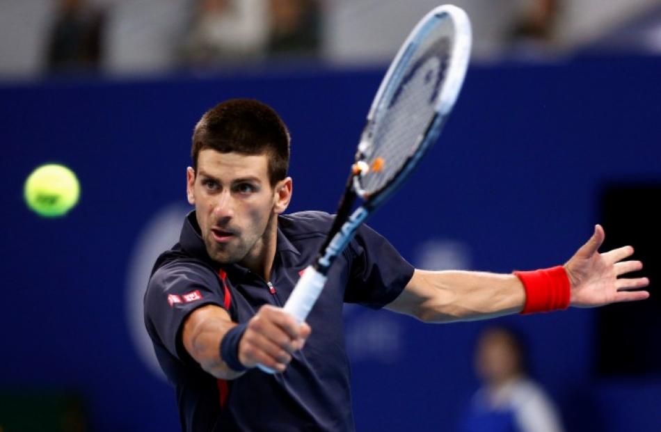 Serbia's Novak Djokovic hits a shot during his second round men's singles match against Argentina...