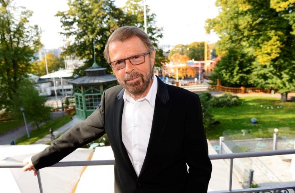 Former ABBA band member Bjorn Ulvaeus poses for photographers in front of a construction site for...