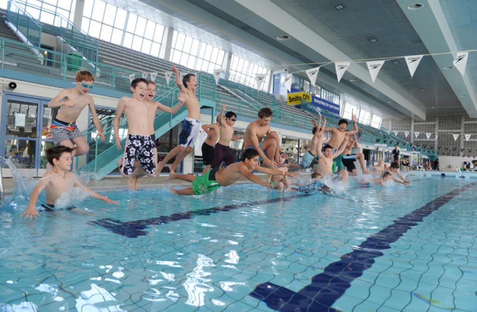 Choirboys take to the pool en masse.