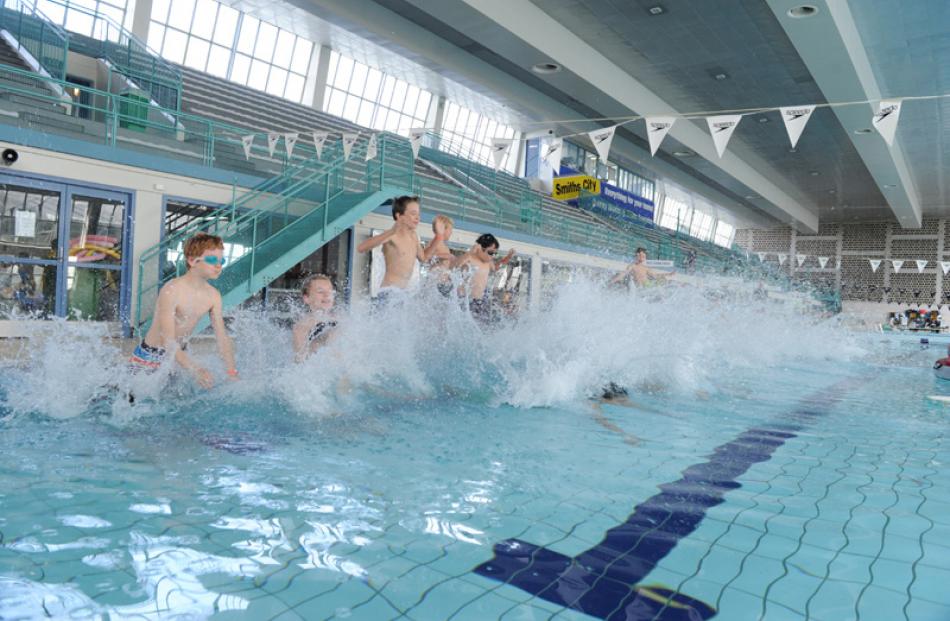 Choirboys take to the pool en masse.