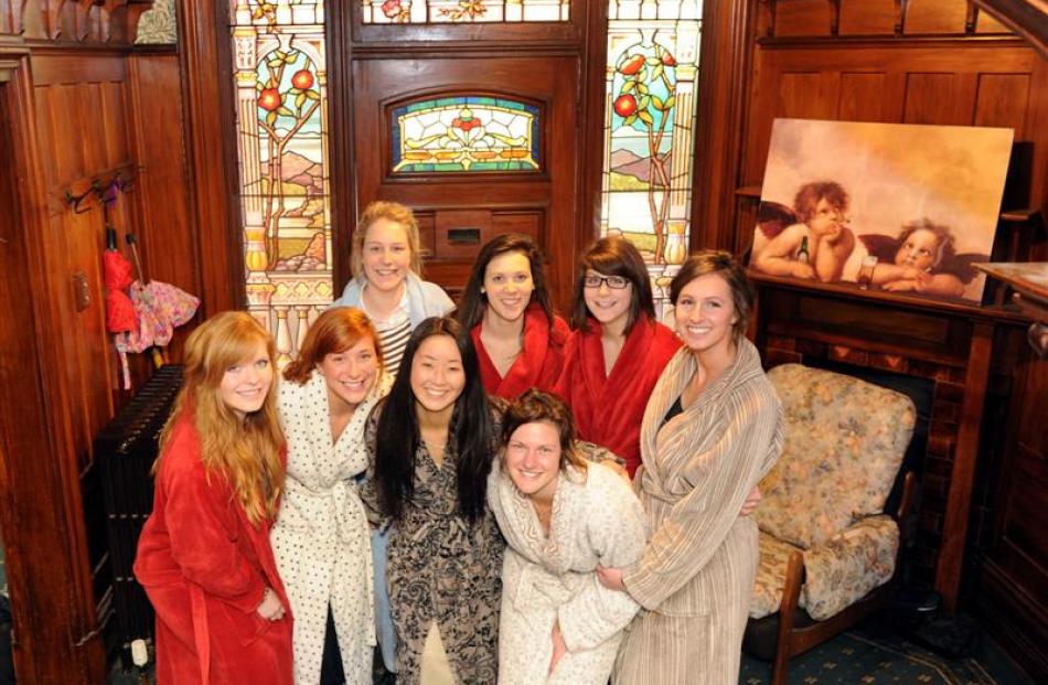 BEST FLAT: Standing in front of the ornate stained-glass doorway of the flat judged best in...