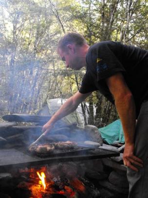 Rafting guide and head chef Roger Leigh prepares our lamb dinner on the second night.