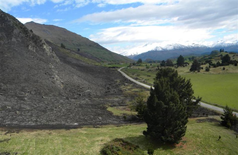 An out of control burn-off beneath Roys Peak, Wanaka, destroyed 350ha, leaving a blackened...
