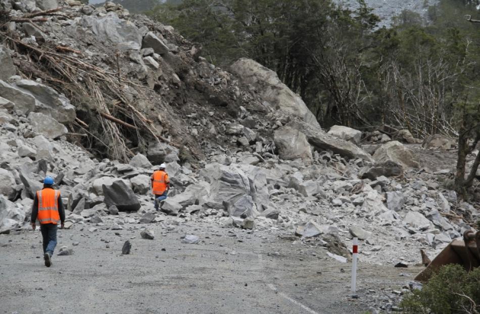 Kevin Watson (left) and Mark Marnane approach the remains of the same boulder after it was...