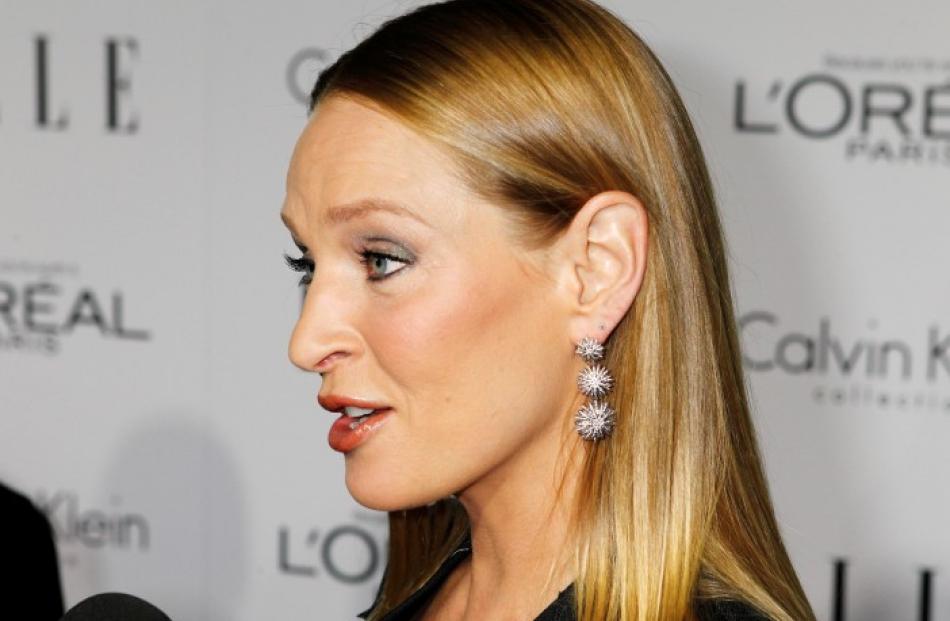 Honouree Uma Thurman is interviewed as she arrives at the 19th Annual ELLE Women in Hollywood...