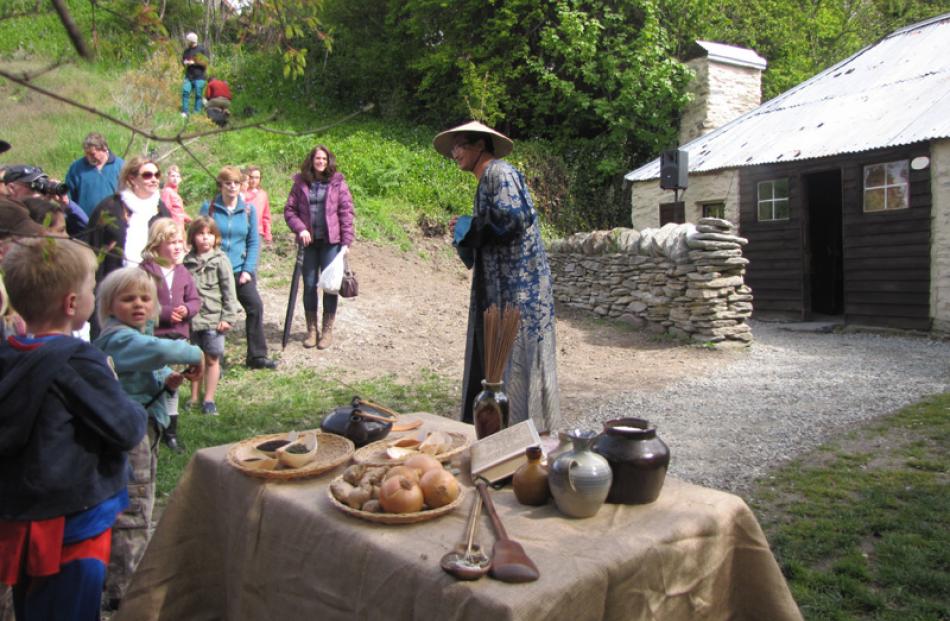 Zee Luv, of Queenstown, performs as Ah Lum, an early Chinese settler who ran the village store.