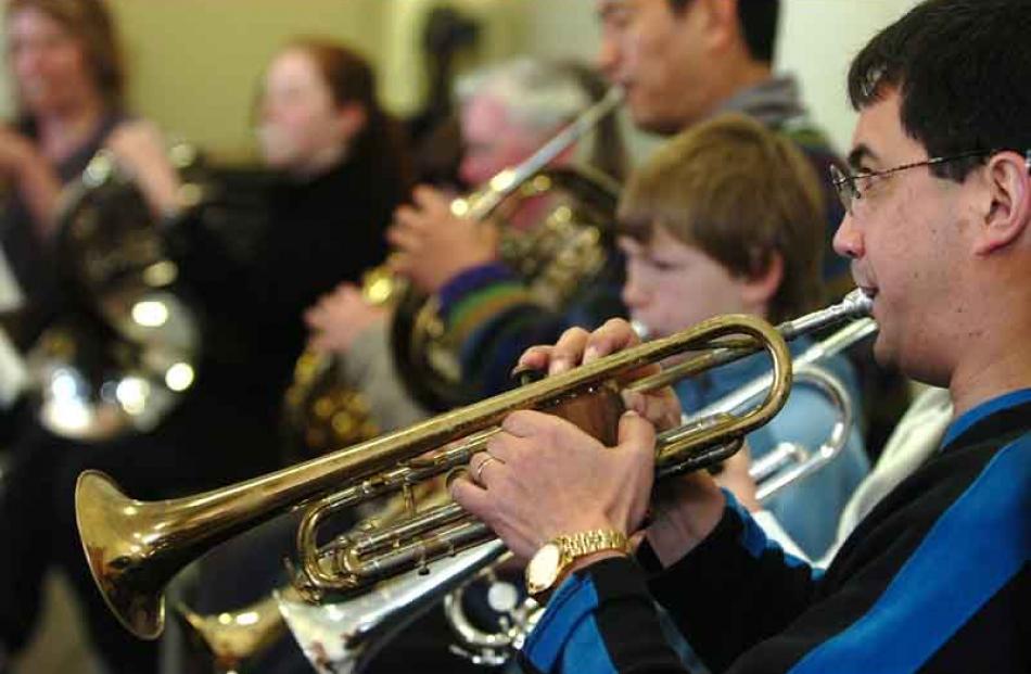 Ah-Lek Tay playing the Trumpet.
