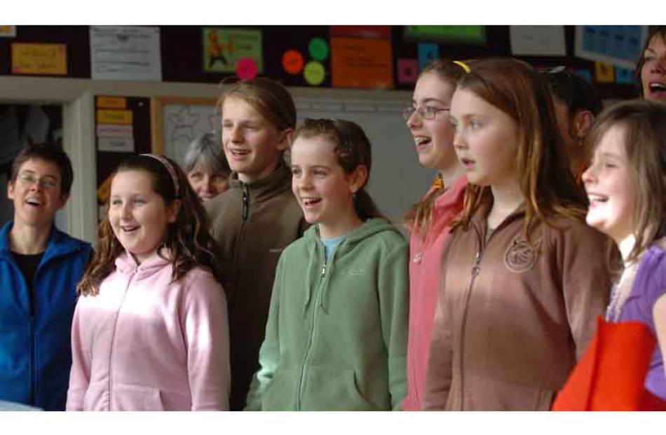 Singing classes from left, Ruth Barnett, Georgia Russell, 11, Michael Baker, 13, Alice Freeman,...