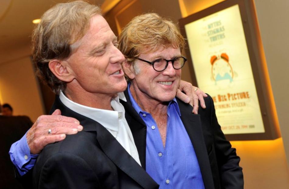 James Redford and his father, actor Robert Redford (R), arrive for the premiere screening of HBO...