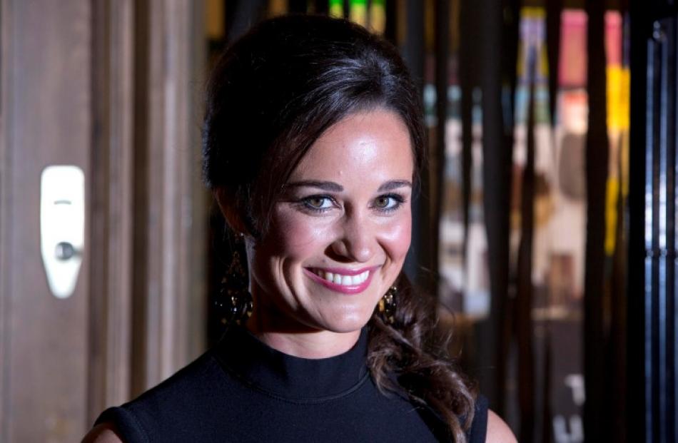 Pippa Middleton poses for photographers to promote her first book 'Celebrate', on the subject of...