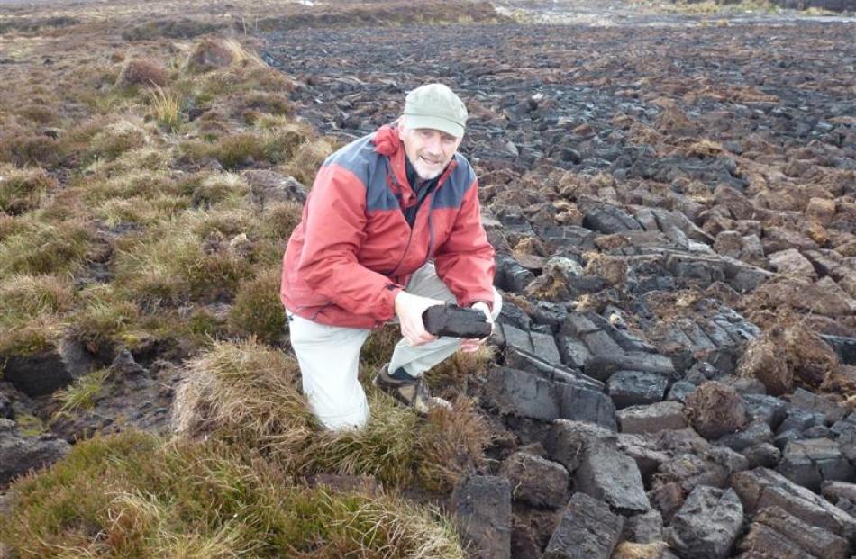 Neville Peat meets Orkney peat at an extraction site at Hobbister Moor. The blocks of peat are...