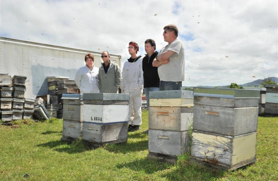 Looking over hives used to breed better Queen bees in Mosgiel are (from left) Betta Bees...
